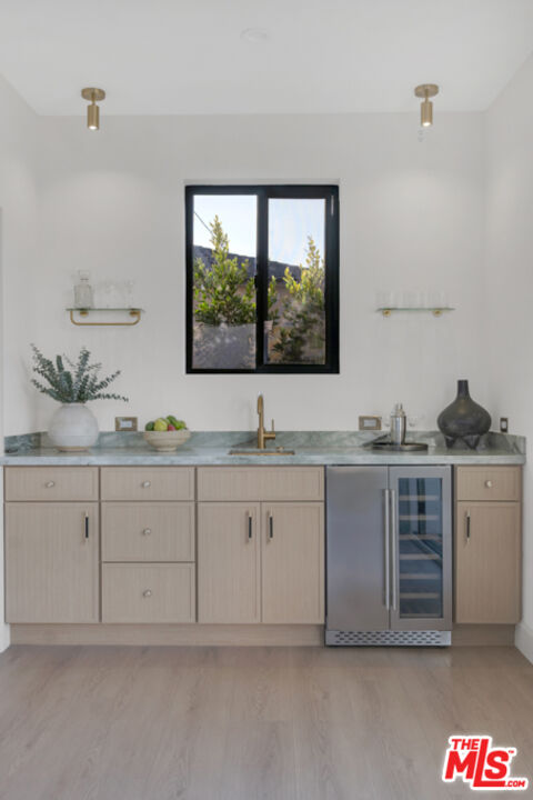 3617 Hillcrest Drive Los Angeles, CA 90016 - Photo 26 of 34 a spacious bathroom with a granite countertop sink and a mirror
