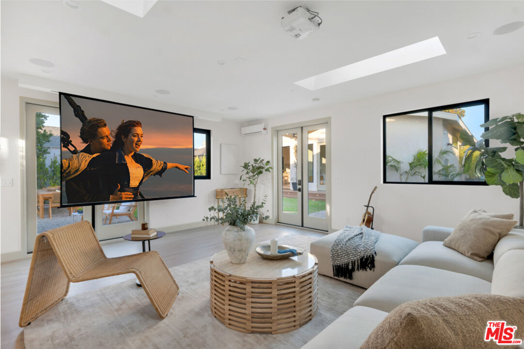 3617 Hillcrest Drive Los Angeles, CA 90016 - Photo 27 of 34 a living room with furniture and a large window