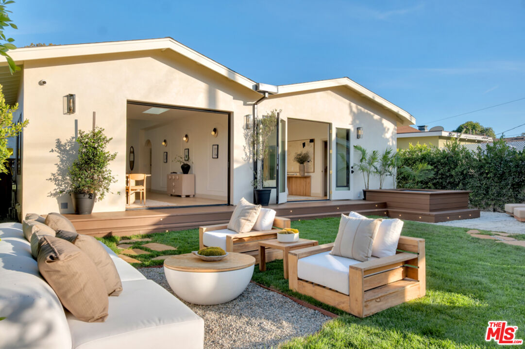 3617 Hillcrest Drive Los Angeles, CA 90016 - Photo 28 of 34 a view of a patio with couches table and chairs and potted plants