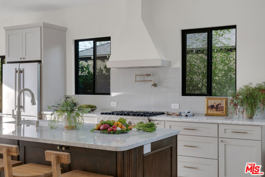 3617 Hillcrest Drive Los Angeles, CA 90016 - Photo 5 of 34 a kitchen with sink and window