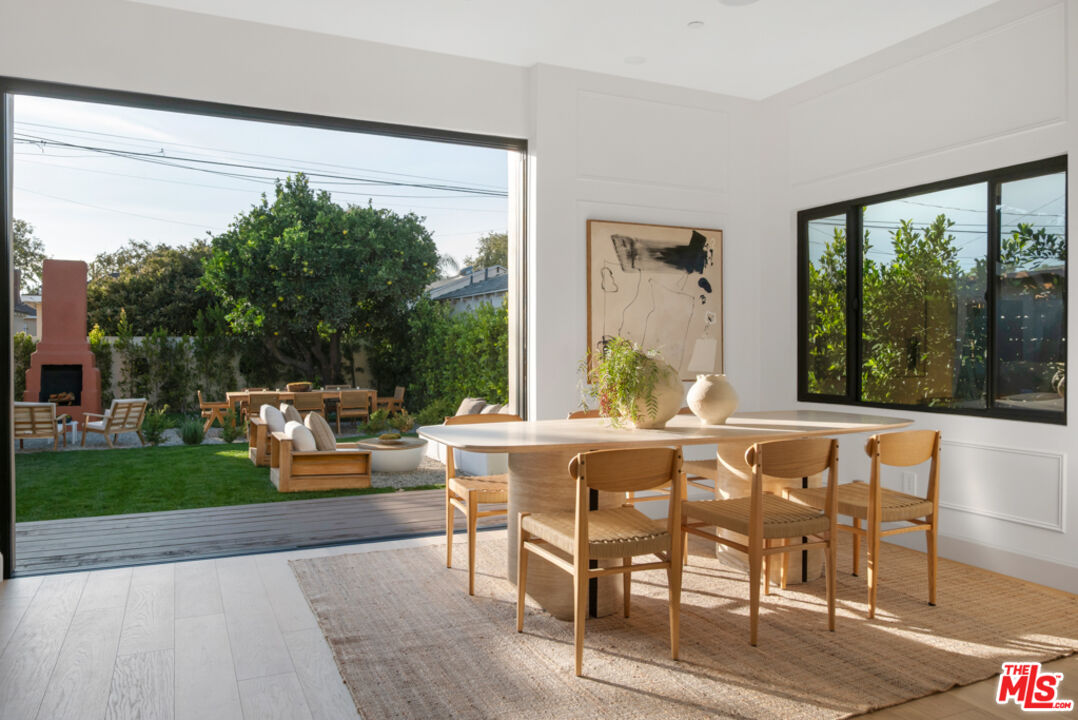 3617 Hillcrest Drive Los Angeles, CA 90016 - Photo 8 of 34 a view of a dining room with furniture window and outside view
