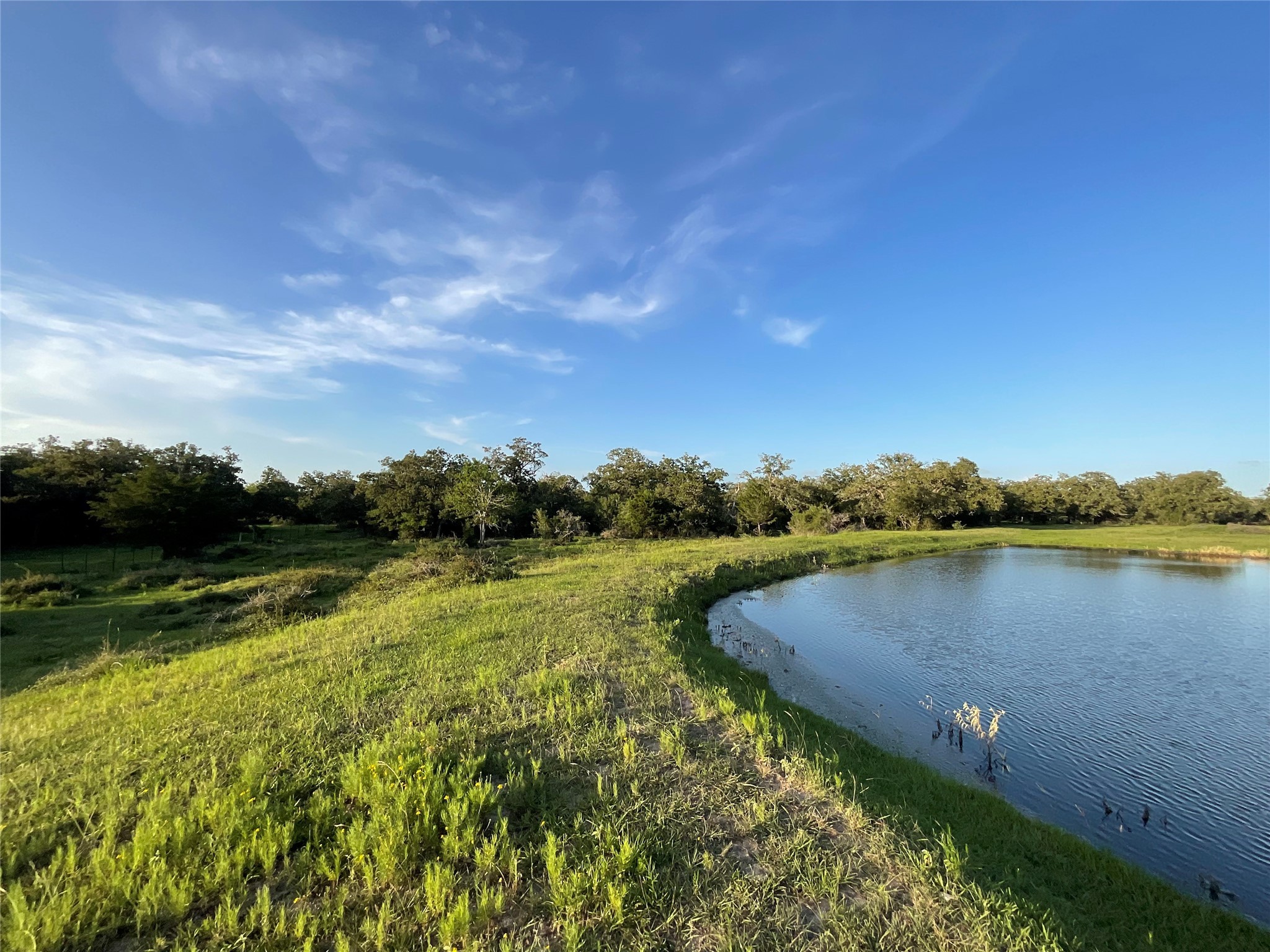 2826 Cattle Guard Road Cuero, TX 77954 - Photo 12 of 45 a view of a lake with houses in the back