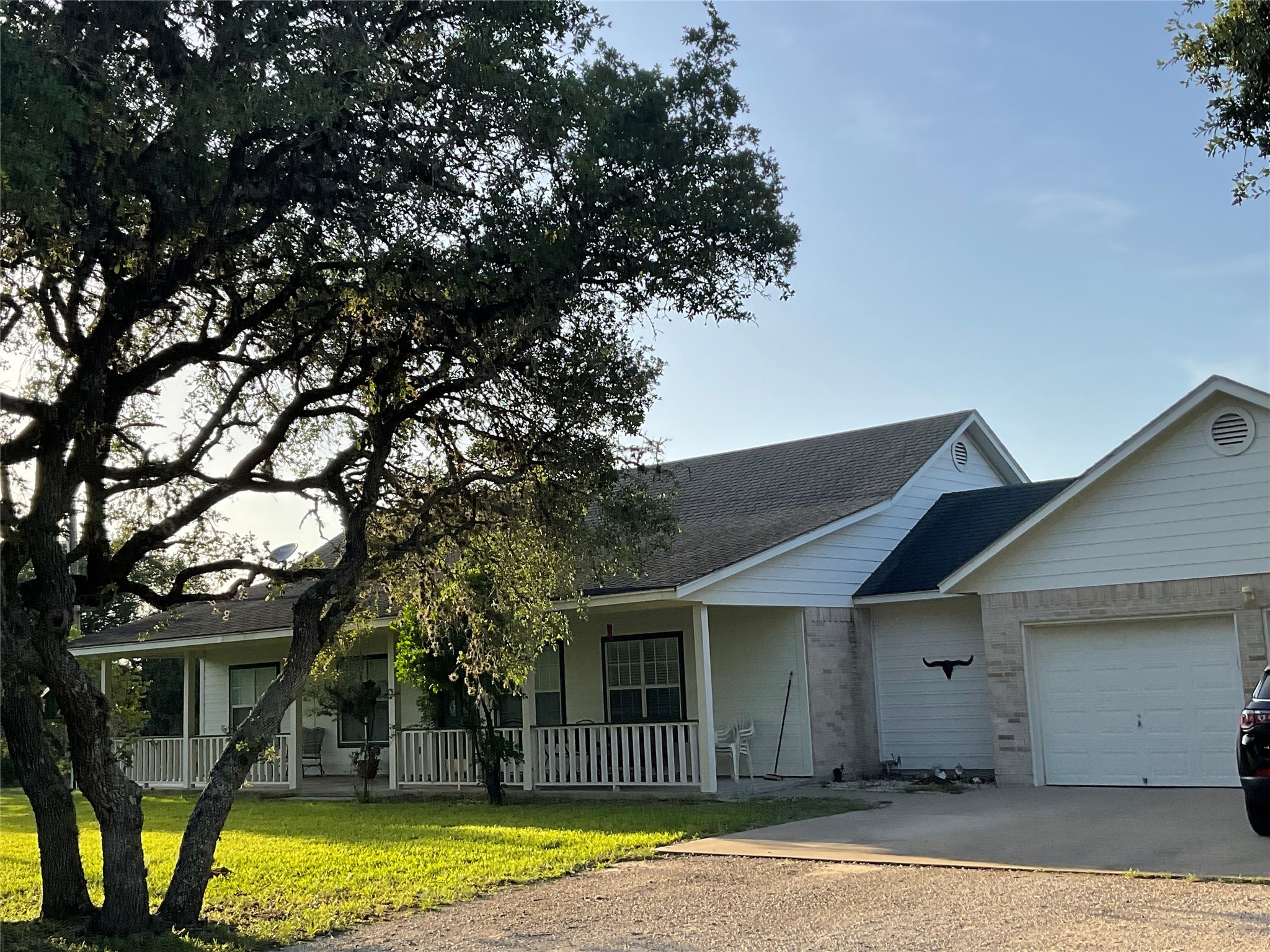2826 Cattle Guard Road Cuero, TX 77954 - Photo 2 of 45 a front view of a house with a yard