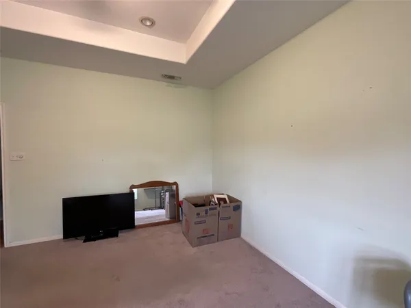 a view of walk in closet and window
