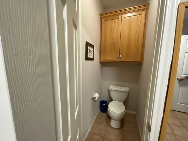 a shelf with cup and plates