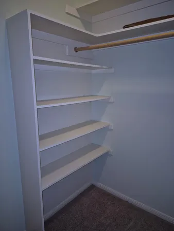a view of small space with racks on the wall