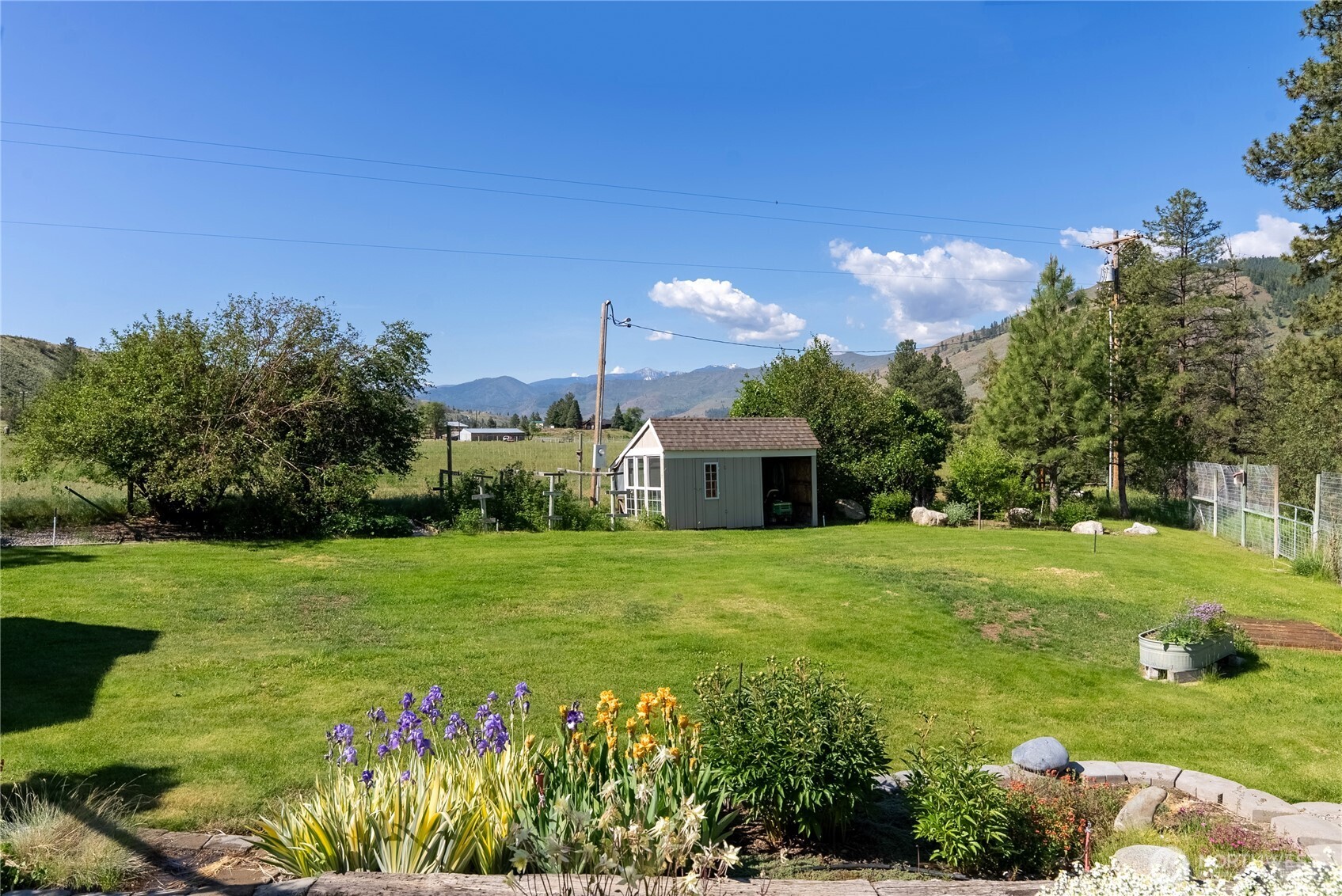 2621 Highway 153 Twisp, WA 98856 - Photo 32 of 40 a front view of a house with garden