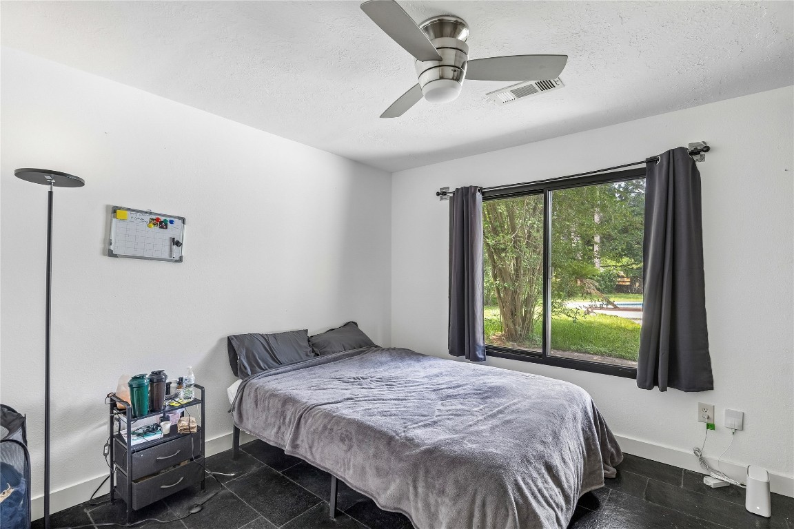 13214 Boca Raton Drive Houston, TX 77069 - Photo 12 of 29 Bedroom 1 overseeing pool with built in shelving