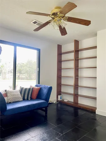 a living room with furniture and a window