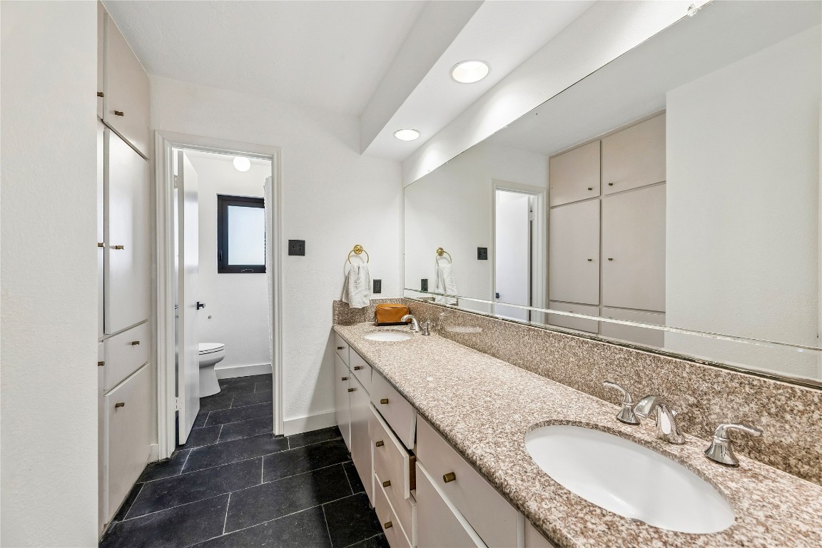 13214 Boca Raton Drive Houston, TX 77069 - Photo 15 of 29 Hallway bathroom, tons of built-in storage cabinets, dual sinks