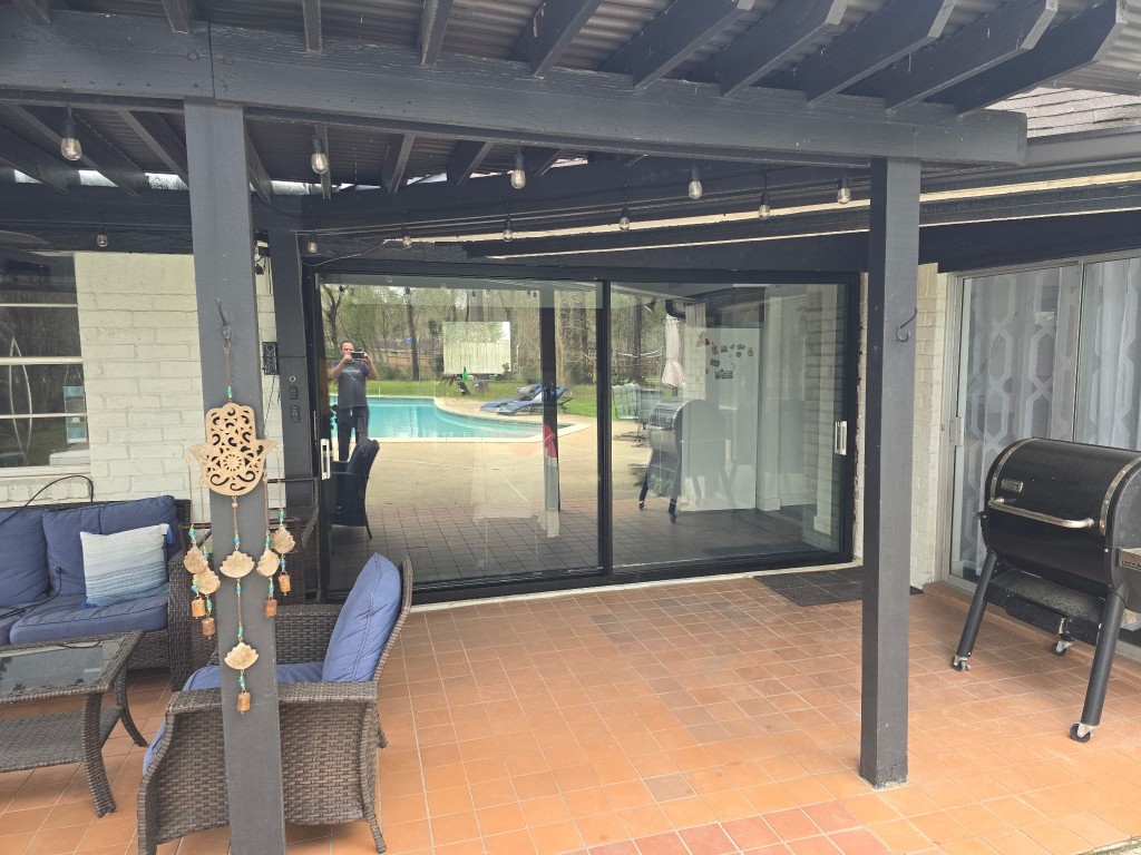 13214 Boca Raton Drive Houston, TX 77069 - Photo 23 of 29 Newly built pergola, and sliding glass wall for indoor/outdoor dining space