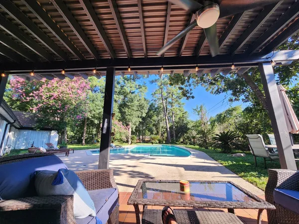a view of swimming pool with a patio