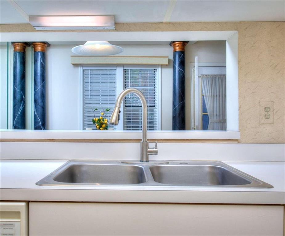 240 Renaissance Parkway Northeast, Unit 116 Atlanta, GA 30308 - Photo 21 of 42 a kitchen with a sink and faucet