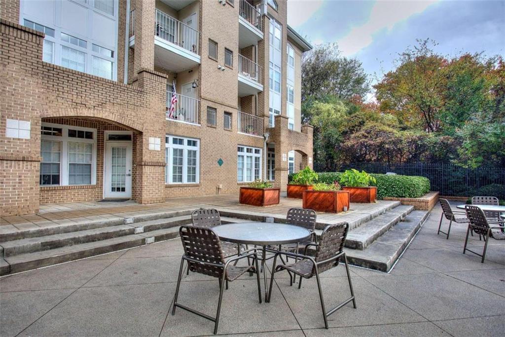 240 Renaissance Parkway Northeast, Unit 116 Atlanta, GA 30308 - Photo 34 of 42 a view of an outdoor seating area