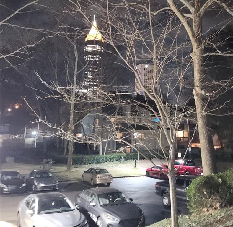 240 Renaissance Parkway Northeast, Unit 116 Atlanta, GA 30308 - Photo 42 of 42 a street view with tall trees