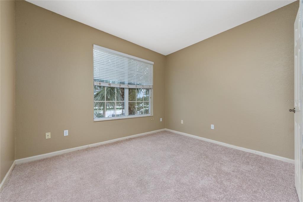 3051 Greystone Loop, Unit 201 Kissimmee, FL 34741 - Photo 11 of 20 a view of an empty room with a window