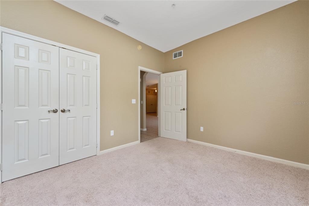 3051 Greystone Loop, Unit 201 Kissimmee, FL 34741 - Photo 12 of 20 a view of an empty room with closet area