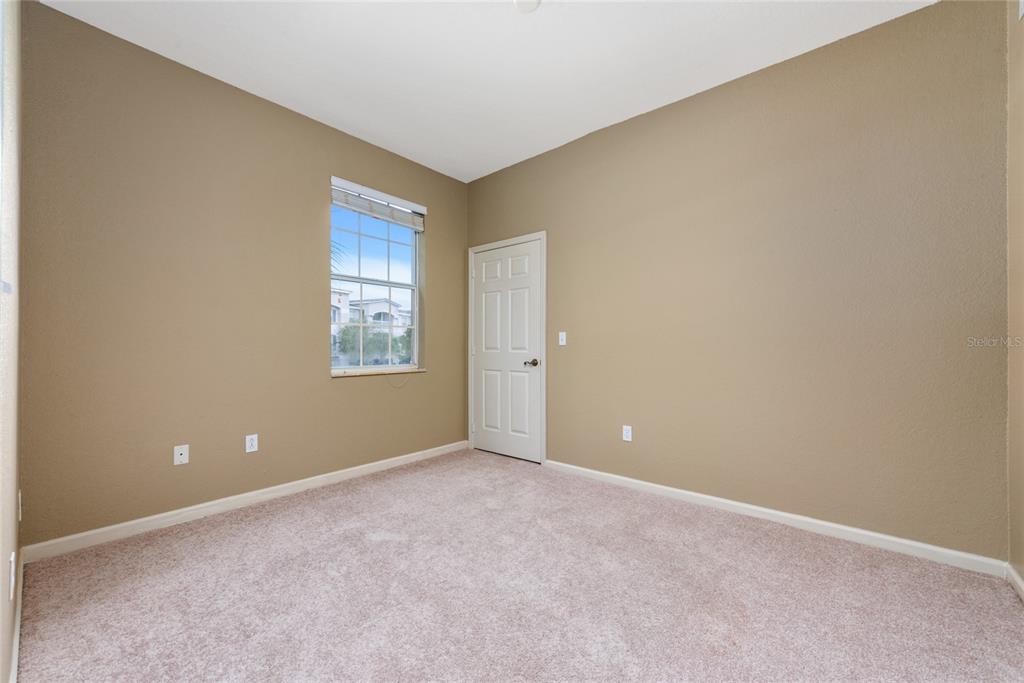 3051 Greystone Loop, Unit 201 Kissimmee, FL 34741 - Photo 13 of 20 a view of an empty room with a window