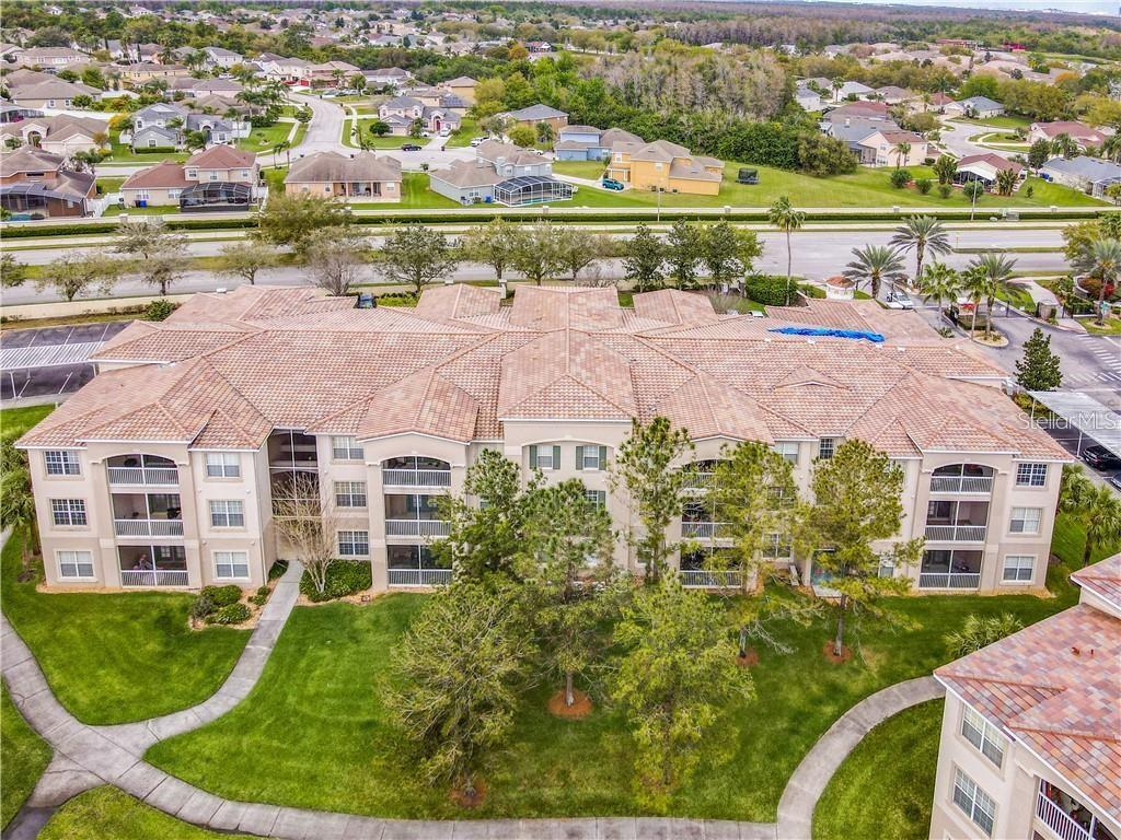 3051 Greystone Loop, Unit 201 Kissimmee, FL 34741 - Photo 14 of 20 an aerial view of multiple house