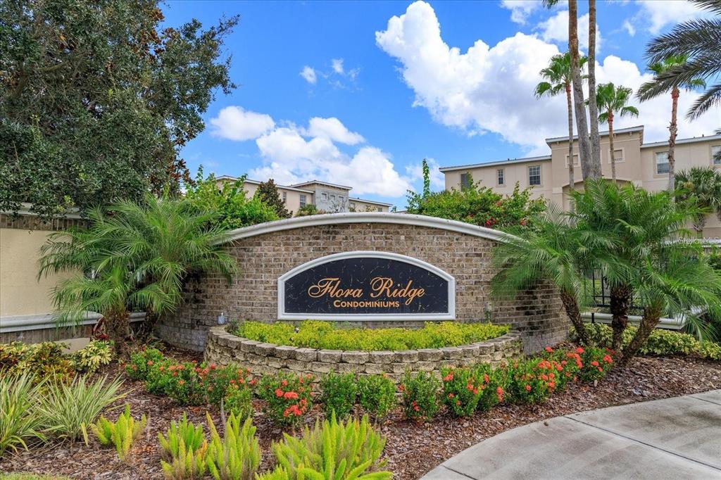 3051 Greystone Loop, Unit 201 Kissimmee, FL 34741 - Photo 15 of 20 a sign that is sitting on a brick wall