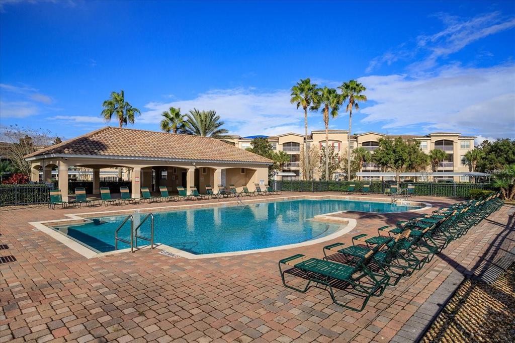 3051 Greystone Loop, Unit 201 Kissimmee, FL 34741 - Photo 19 of 20 a view of a swimming pool with a patio