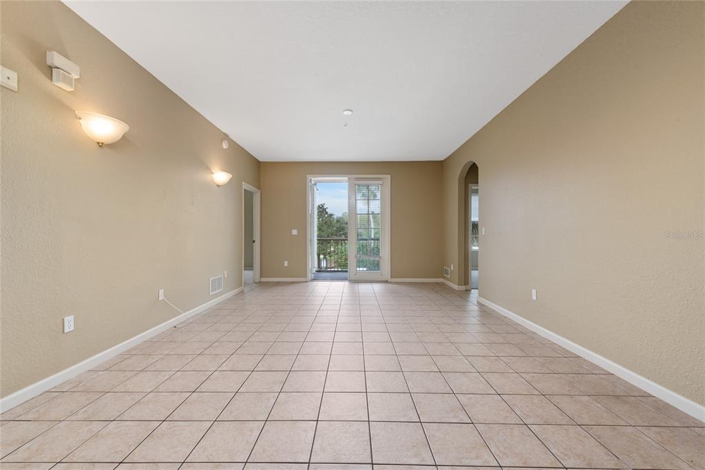 3051 Greystone Loop, Unit 201 Kissimmee, FL 34741 - Photo 5 of 20 a view of an empty room and window