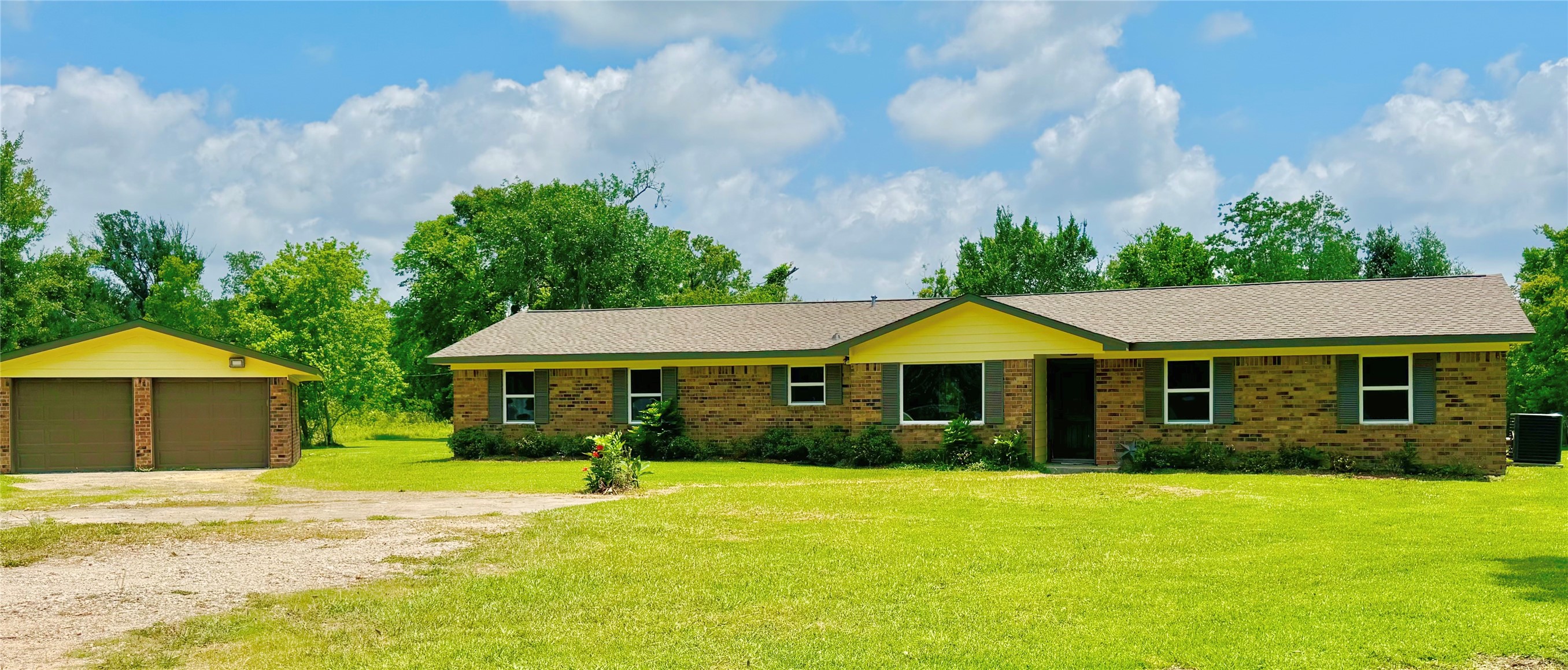 1434 County Road 878A Sweeny, TX 77480 - Photo 2 of 36 a front view of a house with yard and green space
