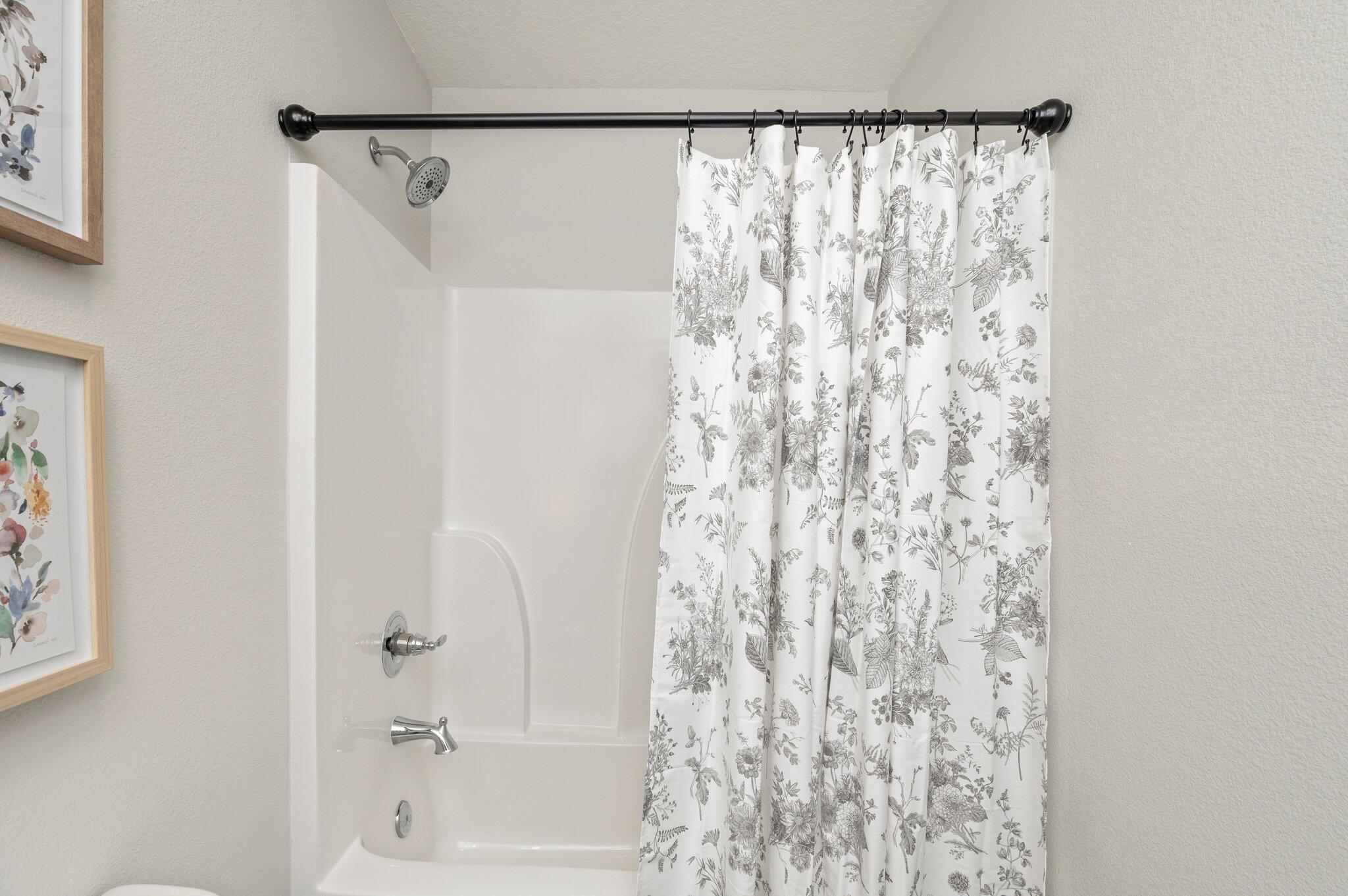 3161 Haskell Langley Road Crestview, FL 32539 - Photo 21 of 36 a bathroom with a shower curtain and a curtain