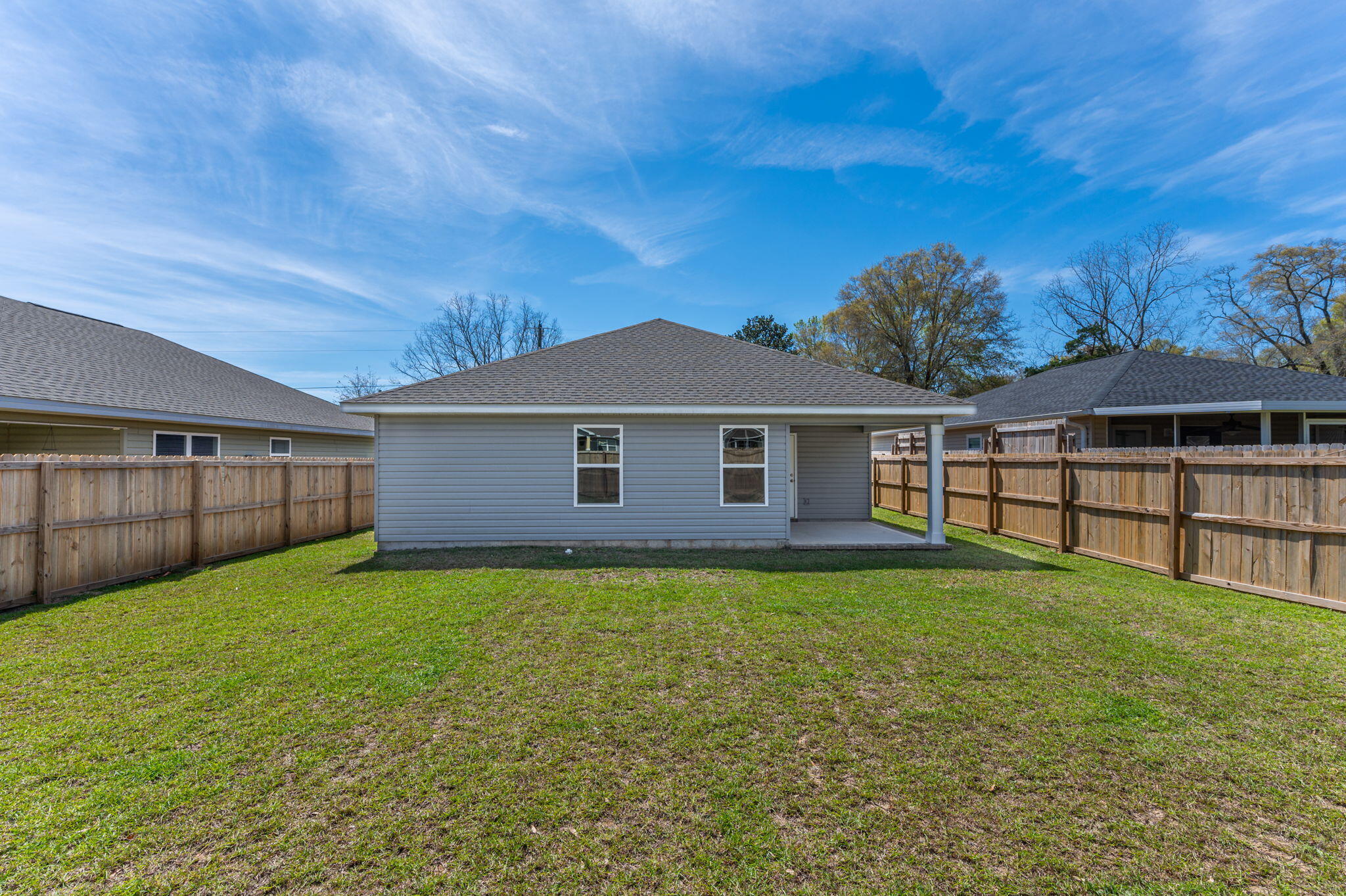3161 Haskell Langley Road Crestview, FL 32539 - Photo 34 of 36 a view of a yard in front of a house with large trees