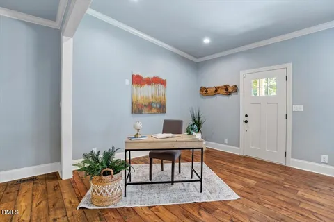 a workspace with furniture and wooden floor