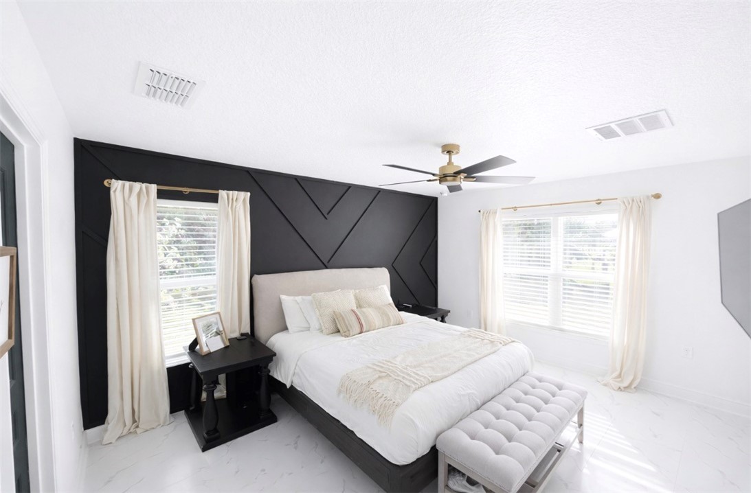 733 Hall Avenue Sebastian, FL 32958 - Photo 14 of 21 a bedroom with a bed and a window