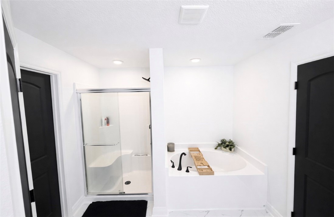 733 Hall Avenue Sebastian, FL 32958 - Photo 17 of 21 a bathroom with a bathtub and a shower