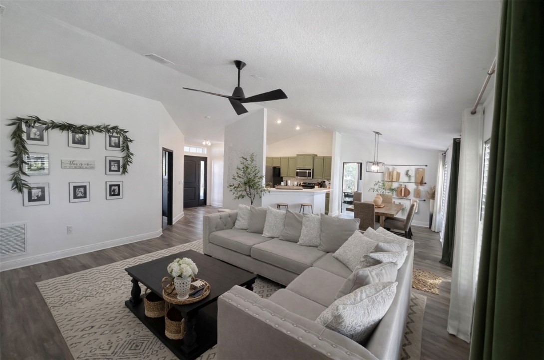 733 Hall Avenue Sebastian, FL 32958 - Photo 4 of 21 a living room with furniture and a view of kitchen