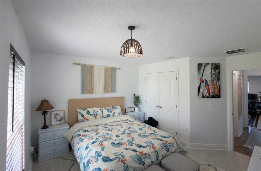 733 Hall Avenue Sebastian, FL 32958 - Photo 8 of 21 a bedroom with a bed and a window