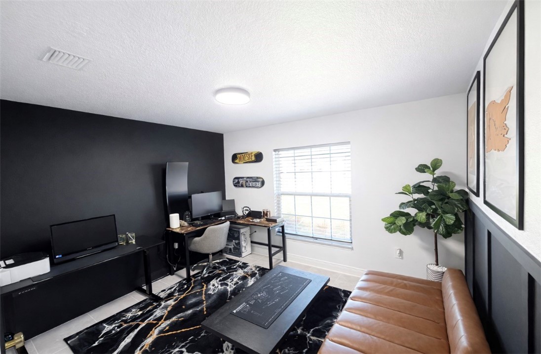 733 Hall Avenue Sebastian, FL 32958 - Photo 10 of 21 a living room with furniture and a potted plant
