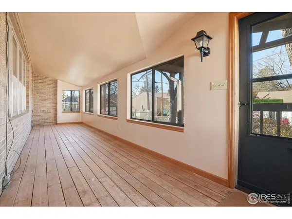 a view interior of a house with wooden floor and windows