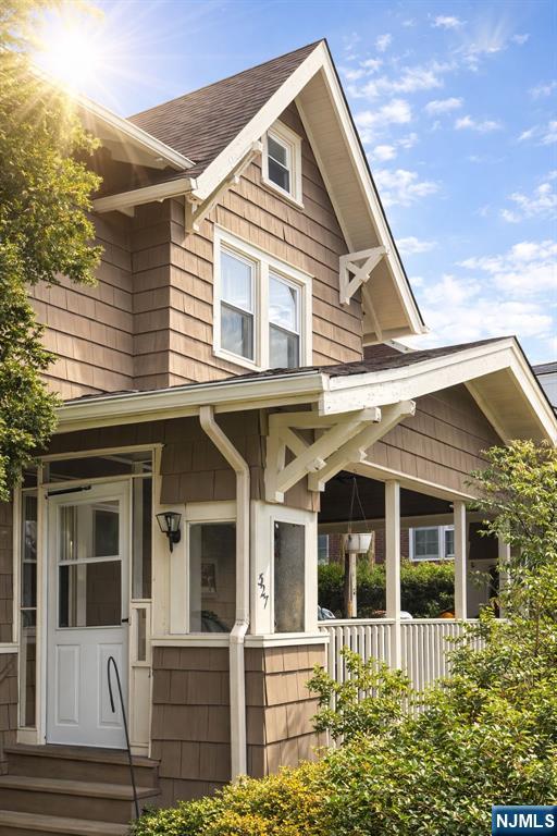 327 Rutland Avenue Teaneck, NJ 07666 - Photo 2 of 12 a front view of a house with a porch