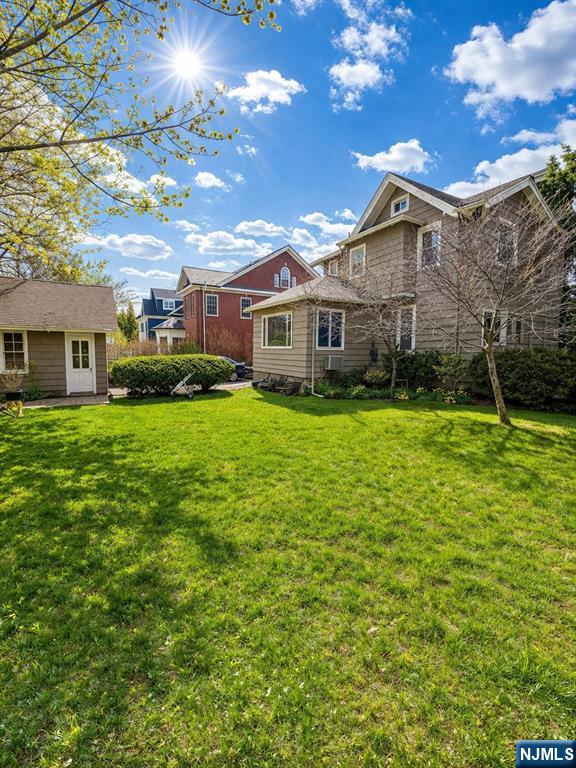 327 Rutland Avenue Teaneck, NJ 07666 - Photo 4 of 12 a view of a house with a big yard and potted plants