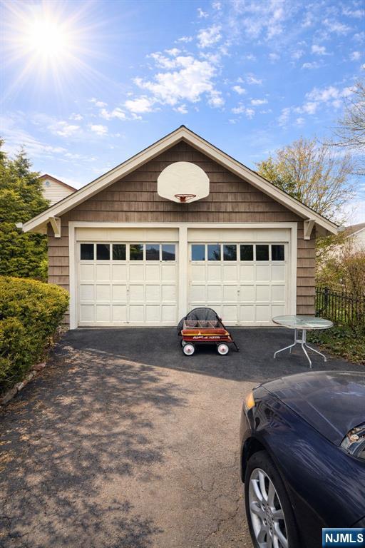 327 Rutland Avenue Teaneck, NJ 07666 - Photo 7 of 12 a car parked in front of a house