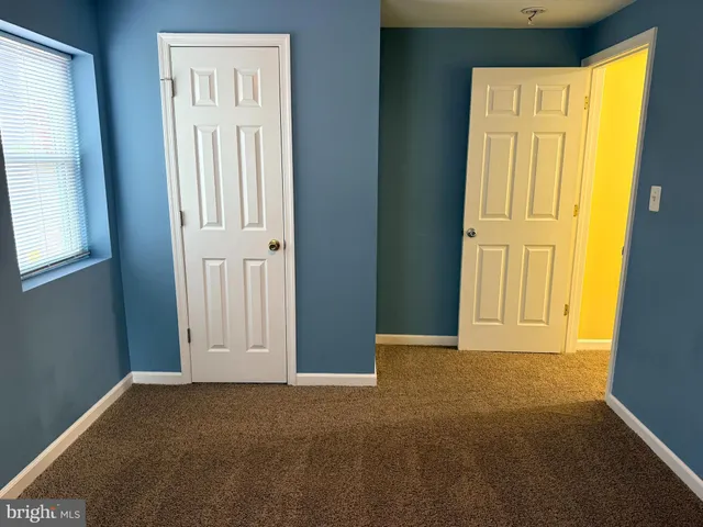 an empty room with a empty space and a window