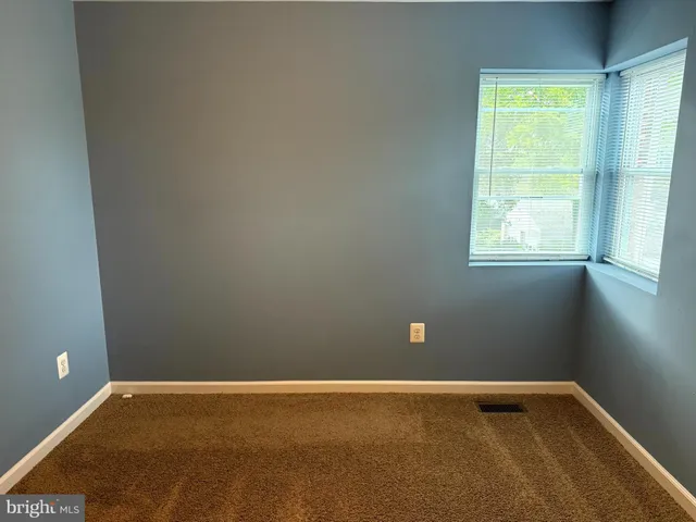 a bathroom with a sink and mirror with toilet