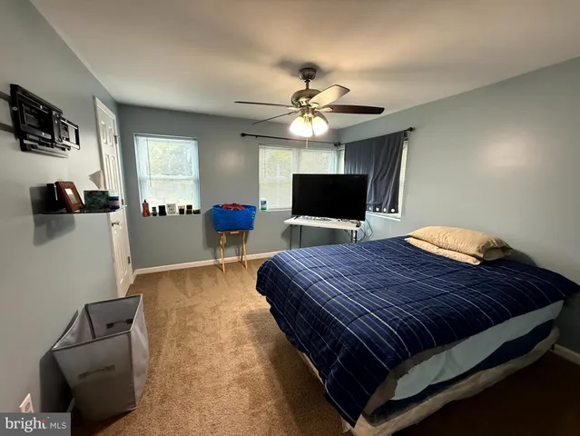 a view of an empty room and wooden floor