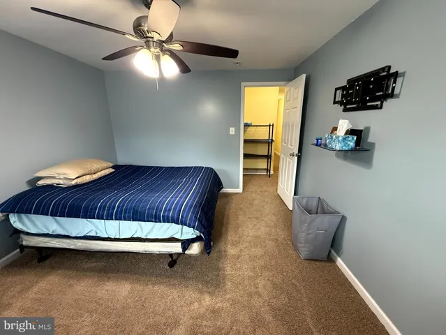 a white toilet sitting next to a bathroom sink