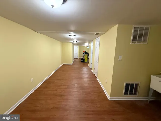 a view of balcony with wooden floor and fence