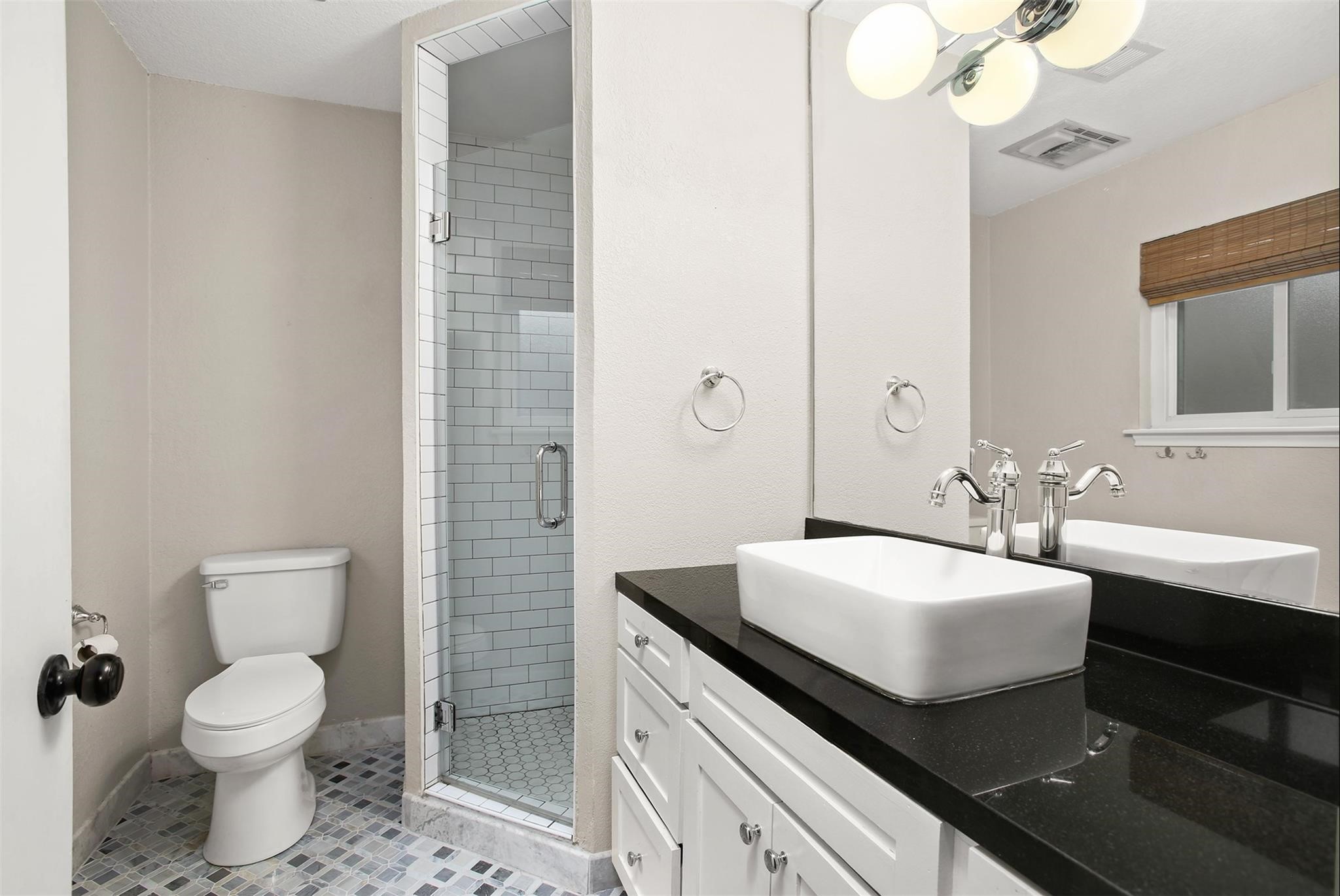 18306 Barbuda Lane Houston, TX 77058 - Photo 15 of 25 a bathroom with a sink a toilet and a mirror