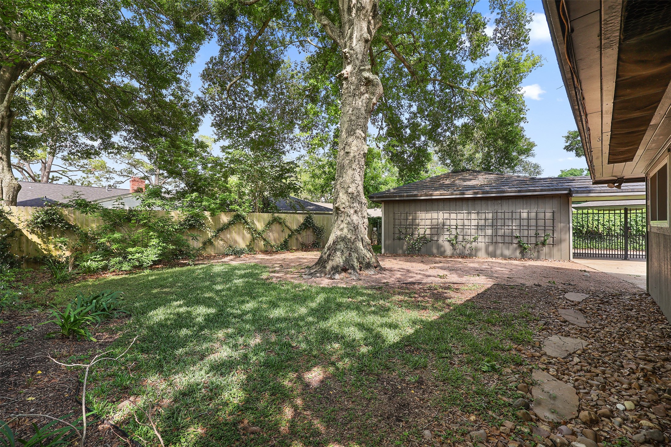18306 Barbuda Lane Houston, TX 77058 - Photo 22 of 25 a view of a house with a yard garage and tree