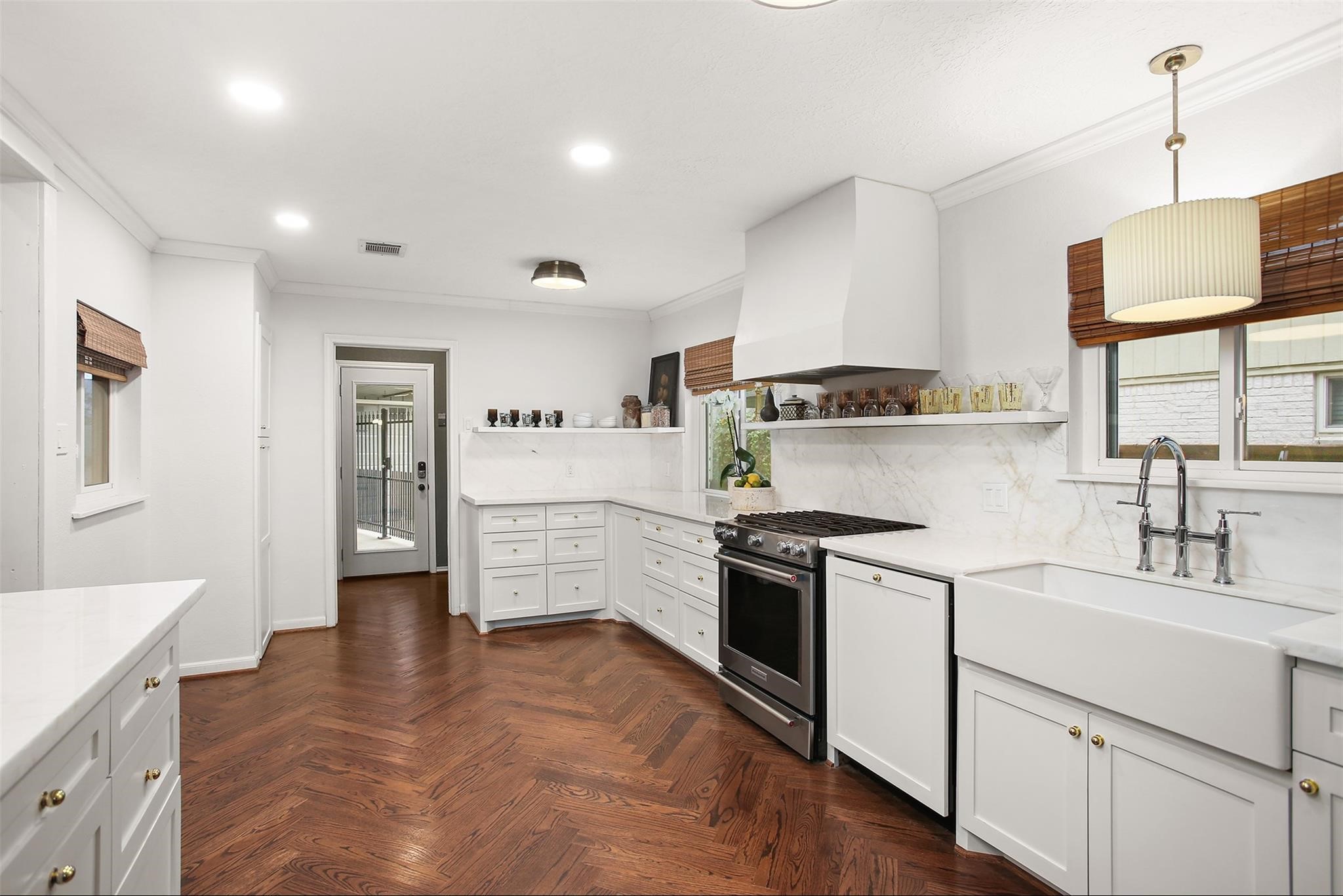 18306 Barbuda Lane Houston, TX 77058 - Photo 5 of 25 a kitchen with stainless steel appliances granite countertop a stove a sink and a refrigerator