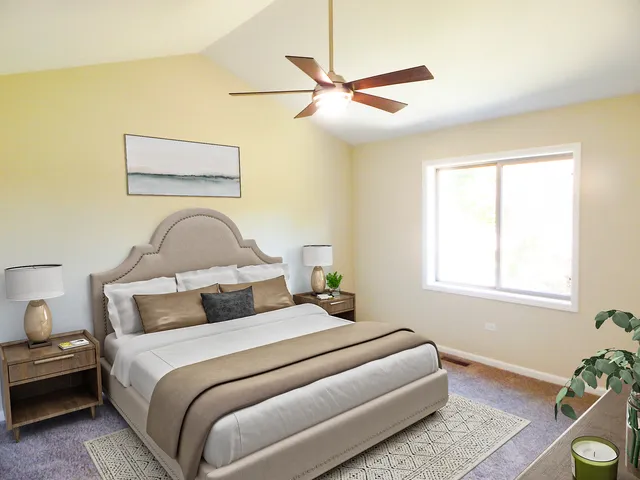 a bedroom with a bed and window