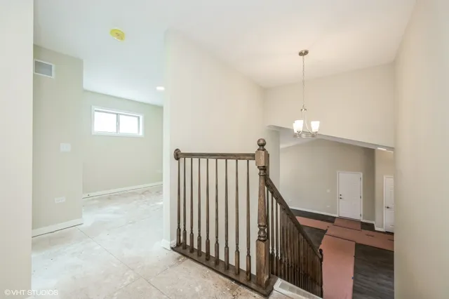 an entryway in a hall with a window