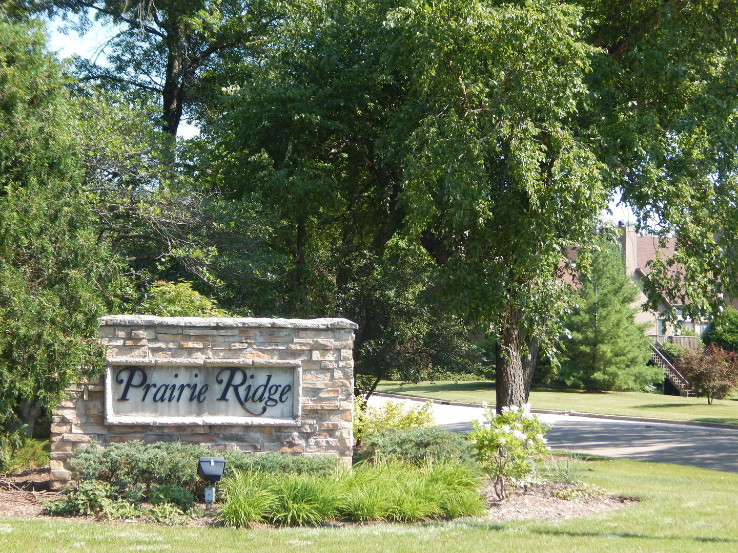 5912 Prairie Ridge Road Crystal Lake, IL 60014 - Photo 22 of 23 a sign that is on the side of a road